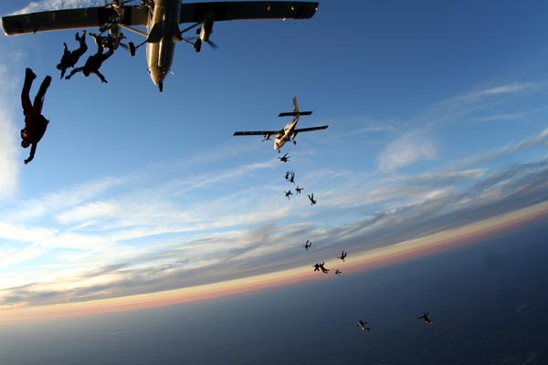 skydivers jumping out plane