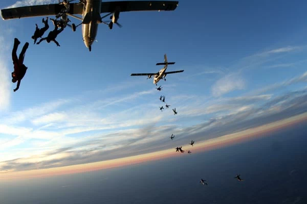 skydivers jumping out plane